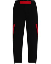 HUGO - Relaxed-Fit Jogginghose mit rotem Logo-Tape - Lyst