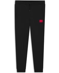 HUGO - Trainingsbroek Van Katoenen Badstof Met Rood Logolabel - Lyst