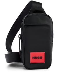 HUGO - Mini-Rucksack mit rotem Logo-Aufnäher - Lyst