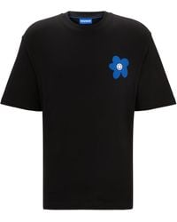 HUGO - T-Shirt aus Baumwoll-Jersey mit Blumen-Logo-Artwork - Lyst