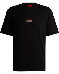 HUGO - Relaxed-Fit T-Shirt aus Baumwolle mit großen Logos auf der Rückseite - Lyst