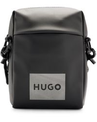 HUGO - Quantum N Crossbody Reporter-Tasche mit dekorativem Logo-Print in reflektierender Optik Schwarz Stck - Lyst