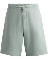 HUGO - Cotton-terry Shorts With Blue Logo Patch - Lyst