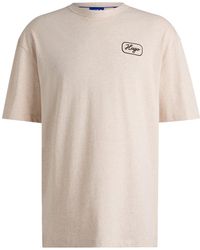 HUGO - Relaxed-Fit T-Shirt Aus Baumwolle Mit Rennsport-Artwork - Lyst
