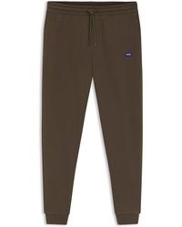 HUGO - Trainingsbroek Van Katoenen Badstof Met Blauwe Logopatch - Lyst