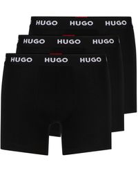 HUGO - Dreier-Pack eng anliegende längere Boxershorts aus Stretch-Baumwolle mit Logos am Bund - Lyst