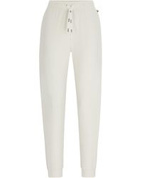 BOSS - Pyjama-Hose aus Stretch-Baumwolle mit Logo-Kordeln und Beinbündchen - Lyst