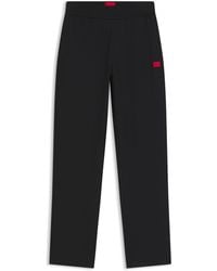 HUGO - Trainingsbroek Van Stretchjersey Met Rood Logolabel - Lyst