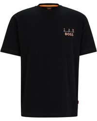 BOSS - Relaxed-Fit T-Shirt aus reiner Baumwolle mit Artwork der Saison - Lyst
