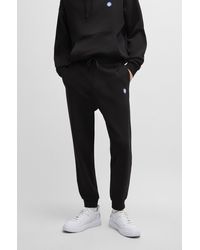 HUGO - Cotton-terry Tracksuit Bottoms With Smiley-face Logo Patch - Lyst
