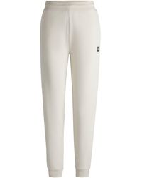 HUGO - Trainingsbroek Van Katoenen Sweatstof Met Tweedelig Logo - Lyst