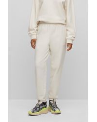 HUGO - Relaxed-fit Tracksuit Bottoms With Embossed Stacked Logo - Lyst