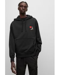 HUGO - Cotton-terry Hoodie With Logo Label And Seasonal Artwork - Lyst
