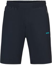 BOSS - Regular-Fit Shorts mit dekorativem reflektierendem Artwork - Lyst