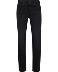 BOSS - Schwarze Tapered-Fit Jeans aus Super-Stretch-Denim - Lyst