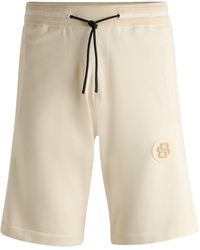 BOSS - Regular-Fit Shorts mit doppeltem Monogramm-Aufnäher - Lyst