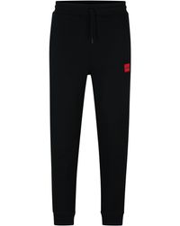 HUGO - Jogginghose aus Baumwolle mit rotem Logo-Patch - Lyst