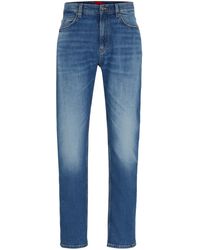 HUGO - Slim-Fit Jeans aus blauem Stretch-Denim - Lyst