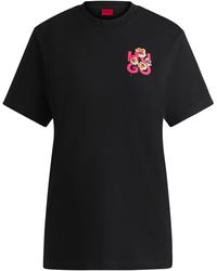 HUGO - Relaxed-fit T-shirt In Cotton With Floral Logo Artwork - Lyst