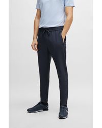 BOSS - Tapered-fit Chinos In Easy-iron Four-way Stretch Fabric - Lyst