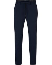 BOSS - Pantalon Slim Fit en jersey stretch performant - Lyst