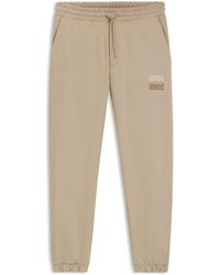 HUGO - Jogginghose Aus Baumwoll-Terry Mit Split-Logo - Lyst