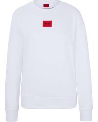 HUGO - Regular-Fit Sweatshirt aus Baumwolle mit rotem Logo-Etikett - Lyst