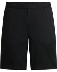 BOSS - Slim-Fit Shorts aus wasserabweisendem Twill - Lyst