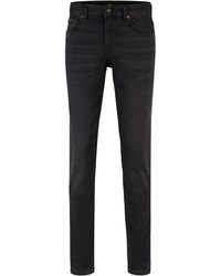 BOSS - Slim-Fit Jeans aus schwarzem Super-Stretch-Denim - Lyst