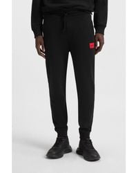 HUGO - Pants - Lyst