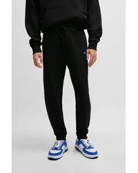 HUGO - Cotton-terry Tracksuit Bottoms With Blue Logo Patch - Lyst