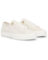 BOSS - Baskets lacées en cuir suédé avec œillets logotés - Lyst