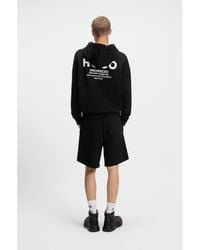 HUGO - Cotton-Terry Loose-Fit Hoodie With Logo Details - Lyst