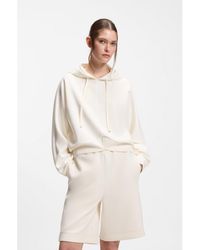 BOSS - Curved-Hem Hoodie With Double B Monogram - Lyst