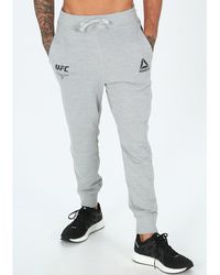 pantalones reebok hombre dorados