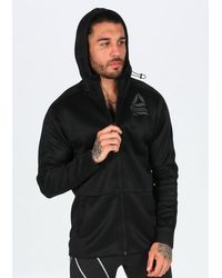chaqueta reebok hombre dorados