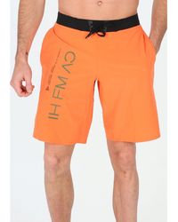 pantalon reebok naranja