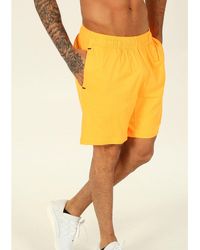 pantalon reebok naranja