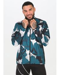 chaqueta reebok hombre dorados