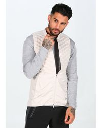 plumas nike hombre beige