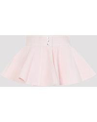 Alaïa - Peplum Belt Tinted Denim Skirt - Lyst