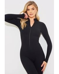 Fits - Built-In Bra Half Zip Long Sleeve Sculpt And Control Unitard - Lyst