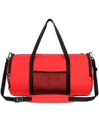 Eastpak - X Telfar Large Duffel Logo Patch Duffle Bag - Lyst