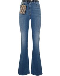 Elisabetta Franchi - Flared Jeans With Belt And Clutch Bag - Lyst