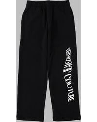 Versace Jeans Couture - Pantalone Track Con Logo "Liquify Rubber" - Lyst