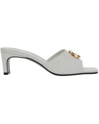 Gucci - Leather Heeled Sandals With Gg Plaque - Lyst