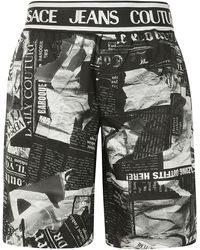 Versace - Magazine-Printed Knee-Length Shorts - Lyst
