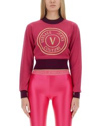 Versace - Cropped V-Emblem Sweatshirt - Lyst