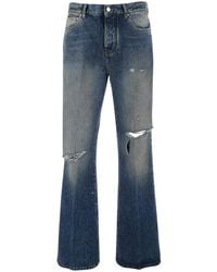 Amiri - Jeans With Rips On The Front And Logo Patch On The Back - Lyst