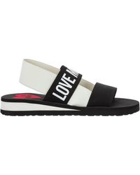 Love Moschino Flat sandals for Women - Up to 66% off | Lyst